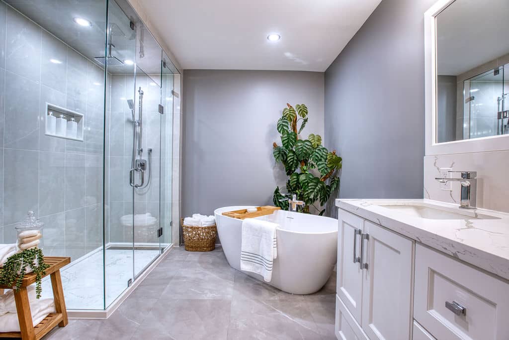 Modern bathroom renovation featuring a glass shower, freestanding tub, and elegant vanity, showcasing Superior Bath's custom design and craftsmanship.