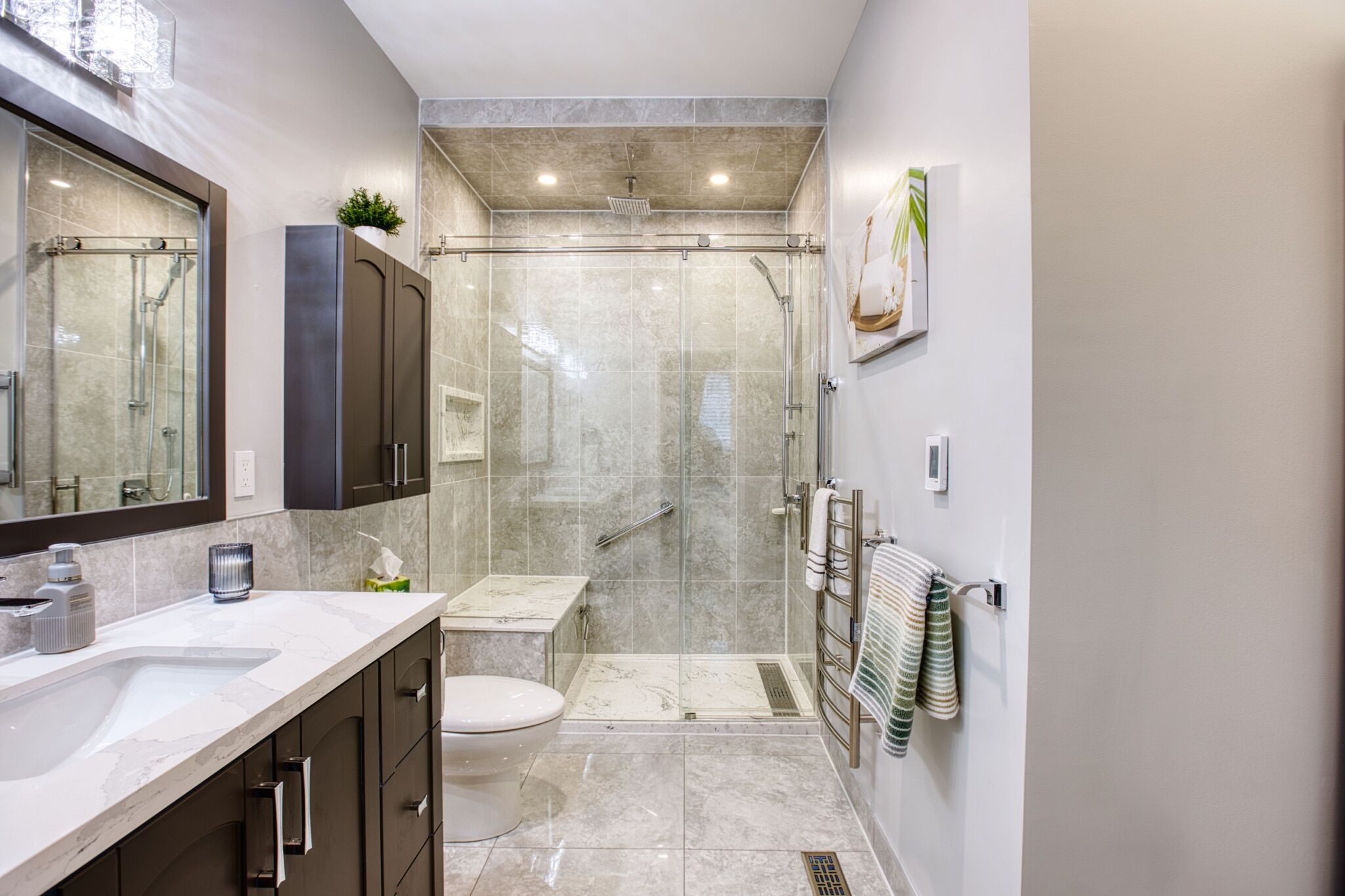Modern bathroom with glass shower, sleek cabinetry, and elegant fixtures showcasing Superior Bath's renovation craftsmanship.